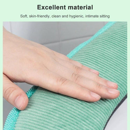 Cozy Washable Toilet Seat Cover for Cold Days - soft green ribbed fabric close-up showing hand touch and plush texture