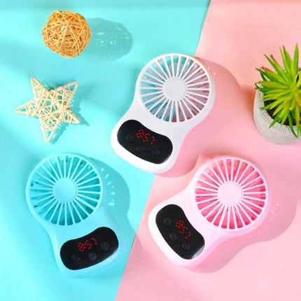 Compact Desktop USB Fan With Built-In Clock in white pink and blue on desk, small USB fan with digital clock display for study or home office
