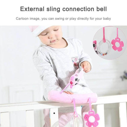 Baby Stroller Cartoon Animal Pendant Rattle for Nursery Use - baby playing with pink cartoon animal rattle attached to crib rail