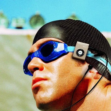 Waterproof Swimming MP3 Player with Clip and Earphones for Sports clipped to swim cap with earphones for underwater workouts