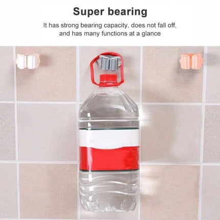 Wall-Mounted Mop Holder for Home Bathroom Storage Organization holding large water bottle on tiled wall to show strong bearing capacity