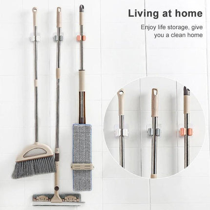 Wall-Mounted Mop Holder for Home Bathroom Storage Organization – wall-mounted mop and broom organizer keeping bathroom tidy and off the floor