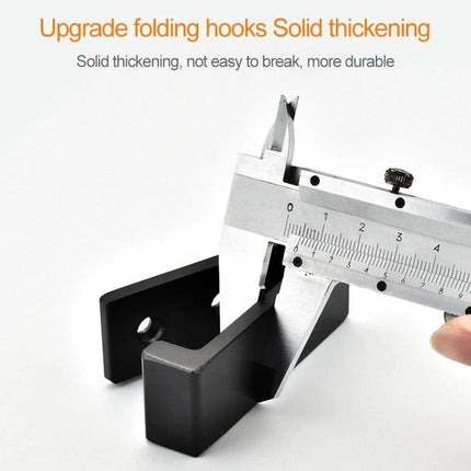 Versatile Wall Hooks for Daily Home Organization Tasks black foldable metal hook shown with caliper measuring thickness