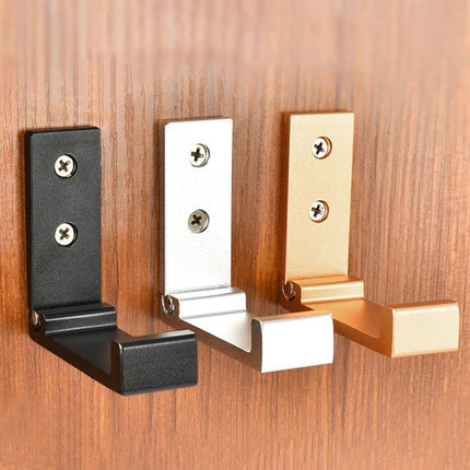 Versatile Wall Hooks for Daily Home Organization Tasks - three foldable metal hooks in black silver and gold mounted on wood