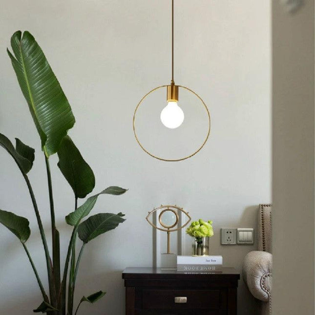 Simple Modern Copper Lamp for Everyday Home Lighting hanging over cozy reading nook with Nordic decor and copper shade