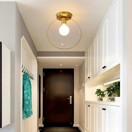 Simple Modern Copper Lamp for Everyday Home Lighting in a Nordic entryway, copper shade ceiling light over hallway with built-in cabinets
