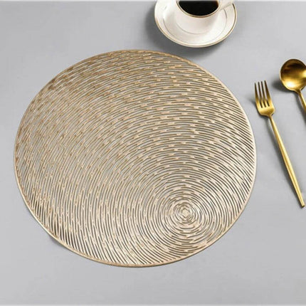 Set Of 2 Round PVC Placemats 38 Cm For Everyday Table Use - Gold textured round PVC placemat on table with cup and gold cutlery