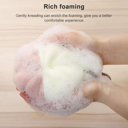 Soft Bath Brush for Daily Home and Travel Exfoliation - hands holding the brush producing rich foaming lather for gentle exfoliation
