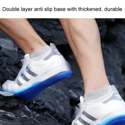 Low Toe Waterproof Shoe Covers for Men and Women Rain Protection shown on white sneakers with thick anti-slip blue sole on rocky trail