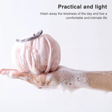 Bath Ball for Daily Skin Care During Home and Travel - lightweight pink PE bath ball with lather on hand for gentle exfoliation