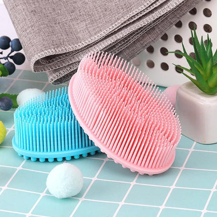 Soft Silicone Brush For Gentle Massage During Baby Bath Time - pink and blue flexible silicone baby bath massage brushes on tiled surface