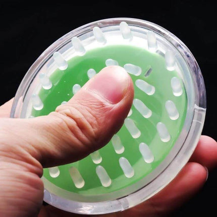 Head Massage Brush Handheld For Scalp Massages Daily Use - handheld green silicone soft-needle scalp massager being gripped for daily self-care