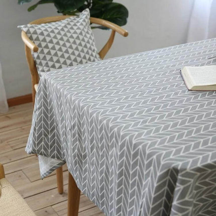 Cotton Linen Tablecloth For Dining Tables With Gray Arrow Geometric Pattern on a dining table with soft drape and matching cushion