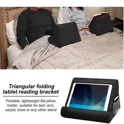 Multifunctional Cushioned Pillow Stand for Laptops and Tablets in use on bed holding tablet and laptop, black cotton blend cushioned lap stand