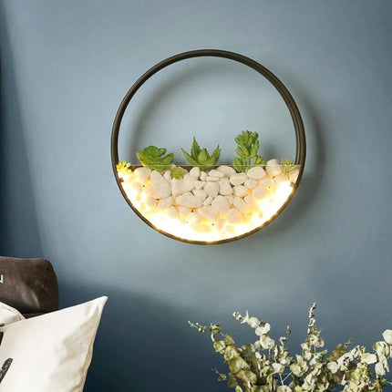 Decorative Wall Lamp for Bedside and Living Room Settings - round wall sconce with succulents, stones and warm LED accent lighting