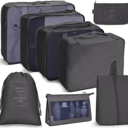 Travel Storage Bag Set Foldable For Luggage Organization showing seven-piece gray packing cubes, toiletry pouch, shoe bag and drawstring laundry sack