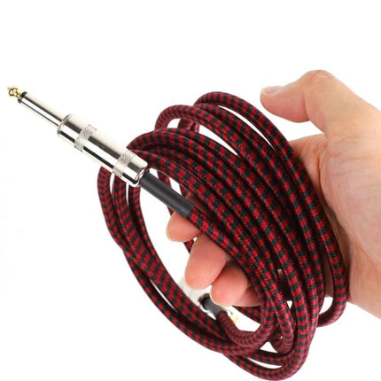 Reliable Guitar Cable for Musicians' Daily Practice and Performances - red braided instrument cable held in hand