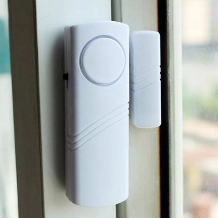 Wireless Door and Window Burglar Alarm for Home Safety mounted on a window frame, white wireless entry sensor and magnet alerting on opening