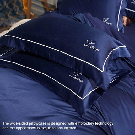 Silk Four Piece Sheet Set Ice Silk Bedding 1.5 to 2.0m navy blue ice silk pillowcases with white piping and embroidered "Love"