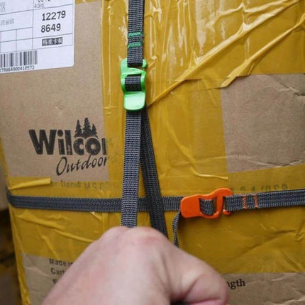 Outdoor Quick Release Camping Clothesline Rope For Hanging Laundry shown fastened with quick-release hooks on a packed box for camping drying