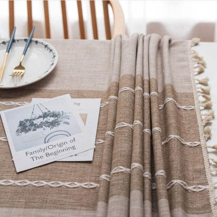 Rectangle Cotton Linen Tassels Dining Tablecloth 140x300cm displayed on a warm beige table with tassel edges