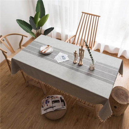 Rectangle Cotton Linen Tassels Dining Tablecloth 140x300cm on wooden dining table with neutral stripes and tassels, styled for casual meals and events