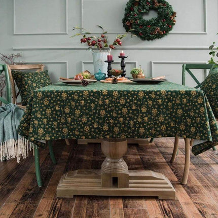 Linen Cotton Christmas Tablecloth 140x180 cm for Dining on a decorated dining table with green lace-print pattern and holiday wreath