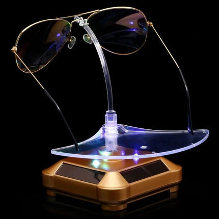 Solar-Powered Rotating Display Stand for Glasses with Lights showcasing aviator sunglasses on illuminated 360° rotating platform