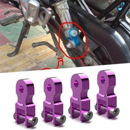 Shock Absorber Extender For Motorcycle, 5 cm Height Increase - purple aluminum rear lift block shown installed on motorcycle swingarm