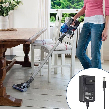 Charging Adapter for Dyson Vacuum Cleaners with Global Plugs shown with compatible DC32 DC33 DC38 vacuum in home setting