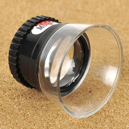 Compact 15X Desktop Magnifier for Reading Maps and Repairs on cork surface showing clear 15X lens and stable desktop base