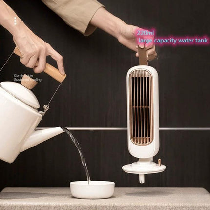 Retro Style Desktop Fan with Humidification and Cooling shown being filled to its 220ml water tank, USB-powered retro desk fan for home or office
