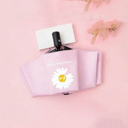 GD Daisy Folding Umbrella for Sun and Rain Protection — compact pink daisy-patterned folding umbrella with iron frame and impact cloth, ideal for commuters