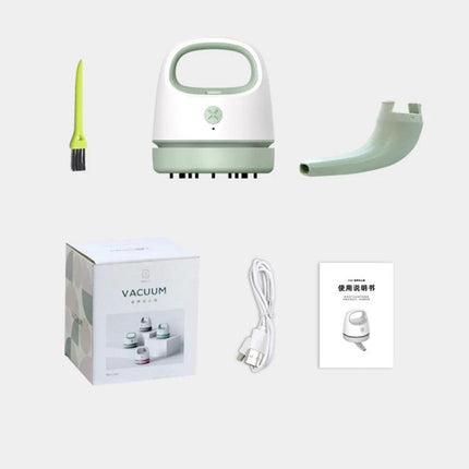 Compact USB Charging Vacuum for Desktop and Keyboard Cleaning with brush, nozzle, USB cable, and packaging