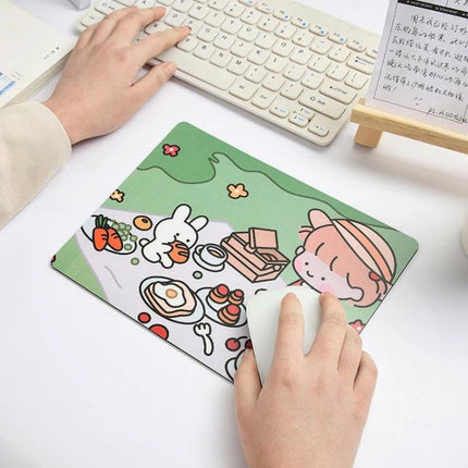 Creative Cute Cartoon Rabbit Mouse Pad Set for Students showing hands using cartoon rabbit picnic design on compact PVC rubber mouse pad