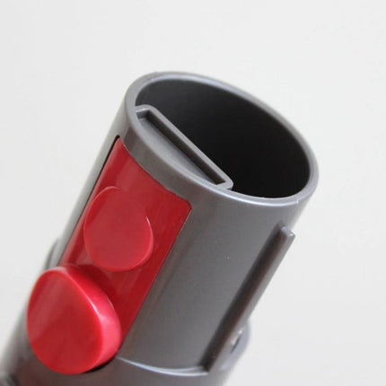 2-Piece Vacuum Adapter for Dyson V7, V8, and V10 Cleaners - close-up of grey ABS adapter with red release button for tight spaces