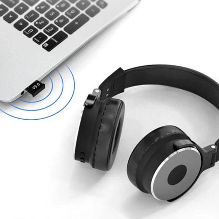 USB Bluetooth Adapter for Wireless Computer Connectivity and Devices plugged into laptop next to wireless headphones, V5.0, 20m range