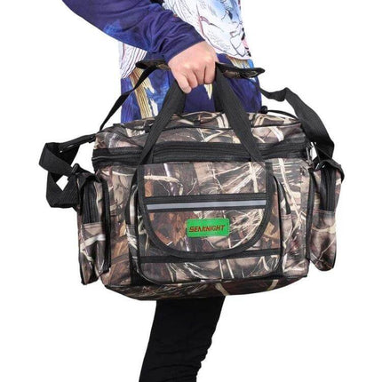 SeaKnight Lure Bag For Fishing Gear Shoulder Messenger in camo nylon carried by angler, multiple pockets for lures and tools