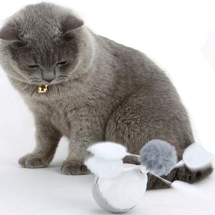 Engaging Tumbler Toy for Cats During Home Playtime with grey cat batting self-running timed tumbler toy