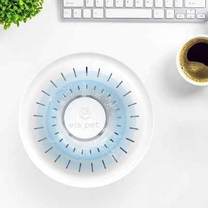 Daily Pet Water Dispenser for Home Hydration Needs on desk with flowing water, quad filtration and modern white design