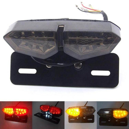 Motorcycle LED Tail Light with Integrated Brake and Turn Signals mounted on black bracket showing wiring and illuminated brake/turn modes