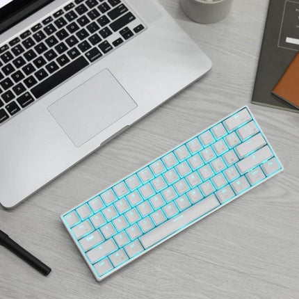 Wireless 61-Key Mechanical Keyboard for Gaming and Office Use - compact white backlit 61-key wireless mechanical keyboard beside laptop for gaming and office