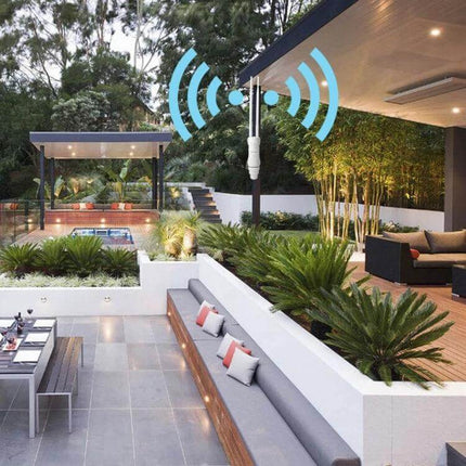 WAVLINK Outdoor Dual-Band Wi-Fi Repeater for Large Area Coverage mounted in modern outdoor patio boosting 2.4GHz and 5GHz signals