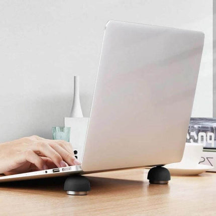 Compact Laptop Stand with Built-in Cooling Fan for Laptops shown elevating and cooling a laptop on a work desk