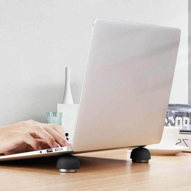 Compact Laptop Stand with Built-in Cooling Fan for Laptops shown elevating and cooling a laptop on a work desk
