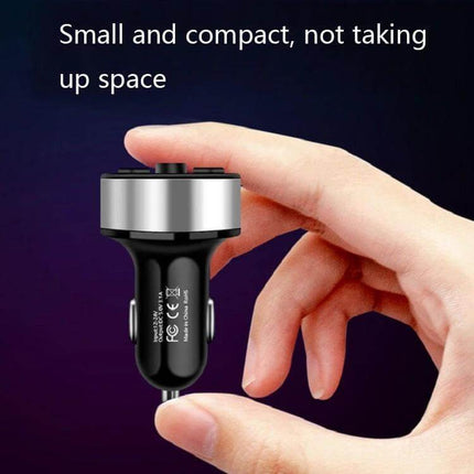 Halo Car MP3 Bluetooth Charger and FM Transmitter Elegant Black held between fingers showing compact size and USB ports