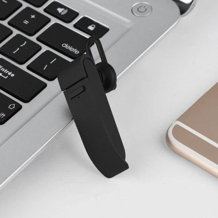 A Practical Voice Translator for Daily Travel Conversations Bluetooth earphone translator clipped to laptop for hands-free travel communication