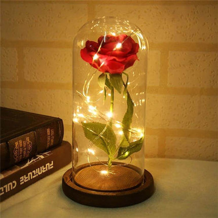 LED Light Rose With Glass Dome For Romantic Home Decor - Red rose in glass dome on wooden base with warm LED glow for intimate ambience