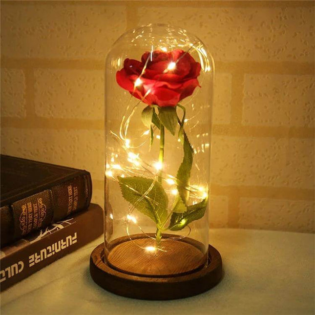 LED Light Rose With Glass Dome For Romantic Home Decor - red rose under clear glass dome on wooden base with warm LED fairy lights for intimate ambience
