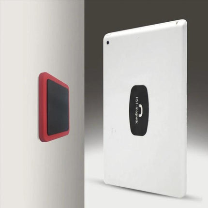 Universal Wall-Mounted Magnetic Holder for iPads and Phones showing tablet magnetically attached to wall for hands-free viewing